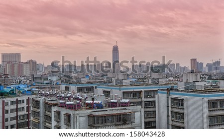 KUNMING, CHINA - MAY 10: skyline of Kunming city during sunset on May 10, 2013 in Kunming, China. Kunming is a fast growing metropolis with an annual population growth rate of 25,000 people in year 2012.