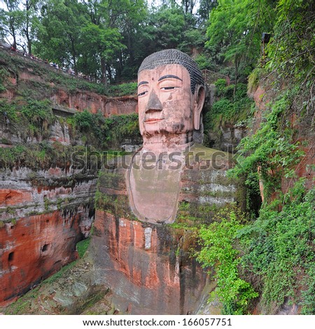 LESHAN - OCT 7: tourists visit world\'s largest Buddha during Chinese National holiday on October 7, 2012 in Leshan, China. During this holiday around 740 million trips will be made by Chinese people.