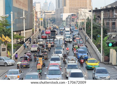 BANGKOK - DEC 22: Traffic jam and air pollution in central Bangkok on December 22, 2013 in Bangkok, Thailand. There are more than 7.5 million registered vehicles on the roads of Bangkok in year 2013.