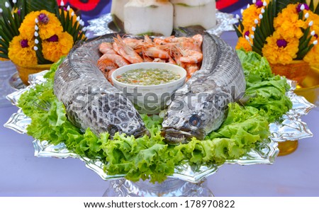 Seafood on plate as religious offering