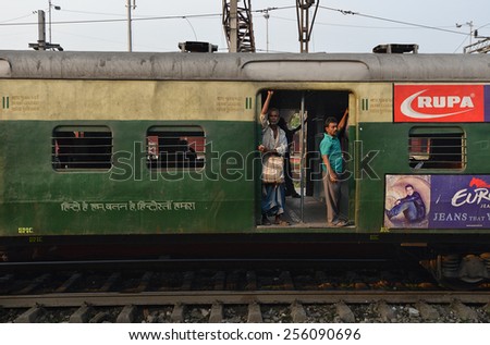 CALCUTTA - MARCH 27: passengers on board a Indian Railways train on March 27, 2014 in Calcutta, India. Indian Railways carried 8.4 billion passengers annually or more than 23 million passengers daily.