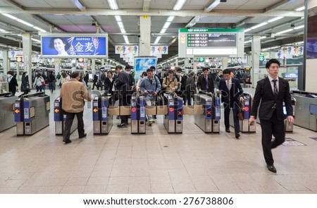 KYOTO - APRIL 10: passengers travel at Kyoto Railway Station on April 10, 2015 in Kyoto, Japan. Japan\'s railways are very busy and carry more than 22 billion passengers annually.