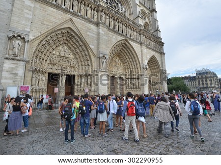 PARIS - JULY 25: tourists visit the Notre Dame Cathedral on July 25, 2015 in Paris, France. In year 2014 more than 15 million tourists visited the city of Paris.