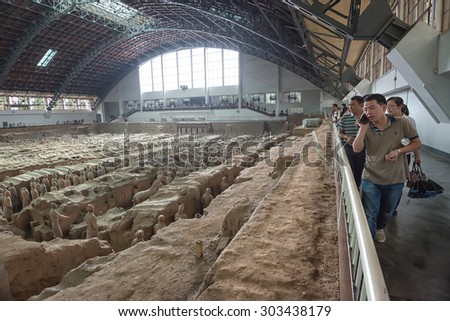 XIAN - MAY 1: Chinese tourists visit Terracotta Warriors site during Mayday holiday on May 1, 2014 in Xian, China. More than 30.000 people visit the Terracotta Warriors site daily.