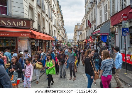 PARIS - JULY 20: tourists visit the Montmartre tourist area on July 20, 2015 in Paris, France. In year 2014 more than 15 million people visited Paris.