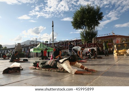 LHASA - SEPTEMBER 8: Tibetan worshippers from all over Tibet pray in front of their holiest temple, the Jokhang on September 8, 2009 in Lhasa