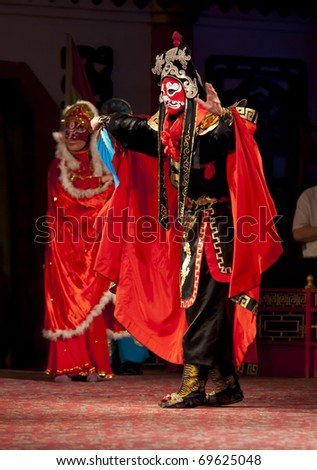 CHENGDU - AUGUST 12: Actors of the Sichuan Opera Troupe perform the famous 
