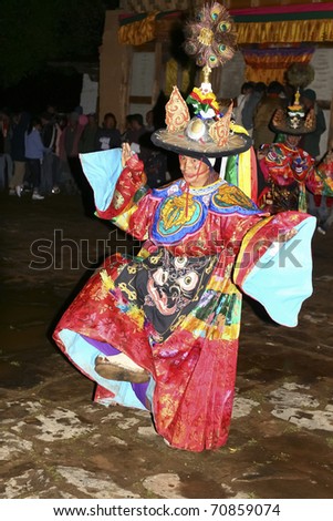 BHUTAN - APRIL 15: A dancer with colorful mask dances at a yearly festival called tsechu on April 15, 2008 in Bhutan