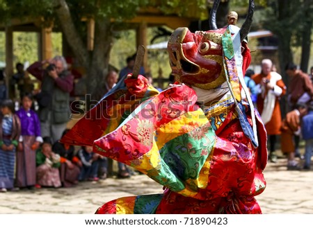 BHUTAN - APRIL 15: A dancer with colorful mask dances at a yearly festival called Tsechu to celebrate Buddhism on April 15, 2008 in Bhutan.