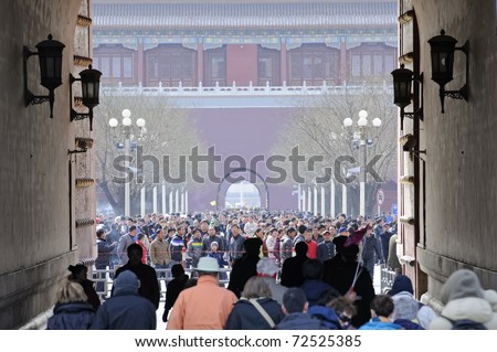 BEIJING - FEB 19: crowd of people travel during Chinese New Year holiday on February 19, 2010 in Beijing, China.At this time tourist sites are overcrowded with people, like here in the Forbidden City.