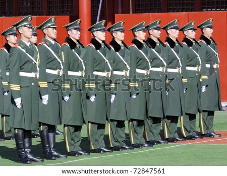 BEIJING - APRIL 2: Chinese soldiers prepare for the national flag ceremony on April 2, 2010 in Beijing, China. Every movement needs to be very precise.