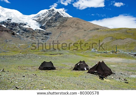 Tents in front of snow mountain (camping in nature)