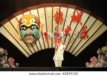 CHENGDU - AUGUST 13: Actor of the Sichuan Opera Troupe performs the famous \