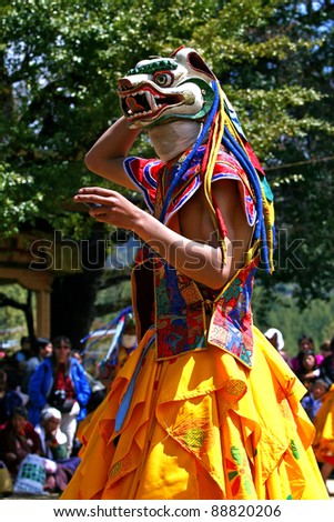 BHUTAN - APRIL 15: A dancer with colorful mask dances at a yearly festival called Tsechu to celebrate Buddhism on April 15, 2010 in Bhutan.