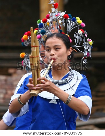 SANJIANG - NOV 12: Dong ethnic minority people perform during the yearly Dong Lusheng festival on 12 November 2010 in Sanjiang, China.