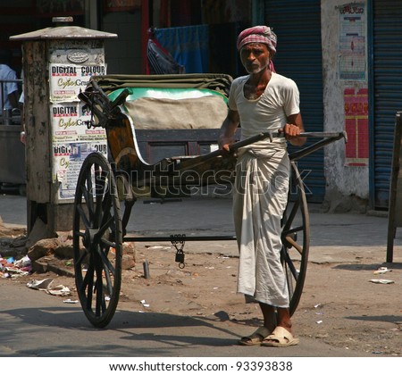 CALCUTTA - MAY 21: rickshaw driver working on May 21, 2011 in Calcutta, India. Rickshaws have been around for more than a century, but they could soon be a thing of the past.