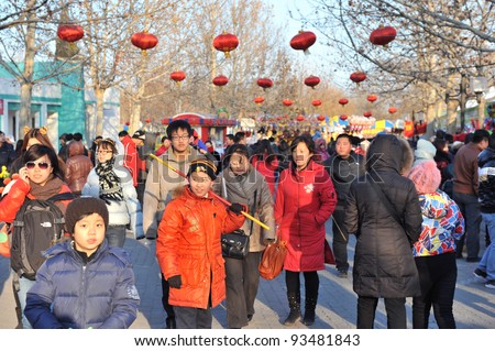 BEIJING - JANUARY 23: crowd of people visit the Beijing International Spring Carnival on January 23, 2012 in Beijing, China. This carnival is held every year to celebrate Chinese New Year.