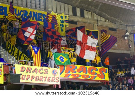 BARCELONA - FEBRUARY 29: Unidentified Barcelona supporters cheer during the Euroleague basketball match between FC Barcelona and Maccabi, final score 70-67, on February 29, 2012, in Barcelona, Spain.