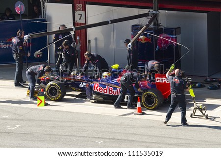 BARCELONA - FEBRUARY 24: Jean Eric Vergne of Toro Rosso F1 team in the pit during Formula One Teams Test Days at Catalunya circuit on February 24, 2012 in Barcelona, Spain.