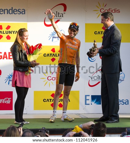 BARCELONA, SPAIN - MARCH 24: Samuel Sanchez (middle) of Euskaltel team wins the Stage 6 of Volta a Catalunya cycling race, on March 24, 2012, in Barcelona, Spain.