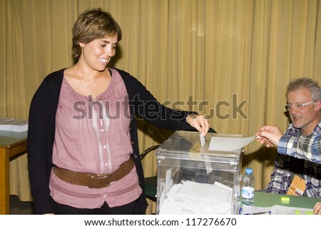 BARCELONA, SPAIN - NOVEMBER 20: An unidentified woman delivers her vote in a polling station during Spanish General Elections on November 20, 2011 in Barcelona, Spain.