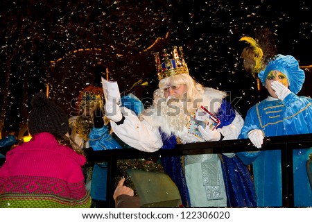 BARCELONA - JANUARY 5: Melchior King at the Biblical Magi Three Kings parade, who give toys to the children. Is a traditional spanish celebration. January 5, 2012 in Alella, Barcelona, Spain.