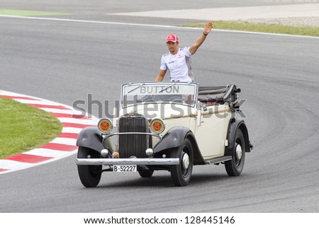 BARCELONA - MAY 13: Jenson Button of McLaren driving a Mercedes classic car before the Formula One Spanish Grand Prix, on May 13, 2012 in Barcelona, Catalonia, Spain. The winner was Pastor Maldonado.