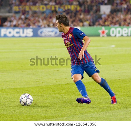 BARCELONA - SEPTEMBER 13: David Villa of FCB in action at the Champions League match between FC Barcelona and AC Milan, 2 - 2, on September 13, 2011, in Camp Nou, Barcelona, Spain.