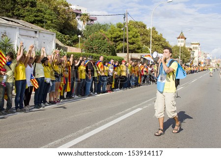 BARCELONA - SEPTEMBER 11: Catalans made a 400km human chain to show their desire for independence from Spain, on Sept. 11, 2013 in Barcelona, Spain. More than 1 million people took part in the event.