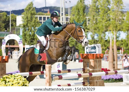 BARCELONA - SEPTEMBER 29: Cameron Hanley from Ireland jumps a horse jumping obstacle at CSIO - Furusiyya FEI Nations Cup Horse Jumping Final Competition, on September 29, 2013, in Barcelona, Spain.