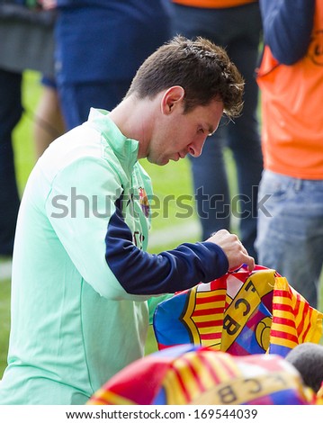 BARCELONA, SPAIN - JANUARY 3: Leo Messi signing autographs at FC Barcelona team in open doors training session at Mini Estadi stadium, with 13,200 spectators, on January 3, 2014, in Barcelona, Spain.