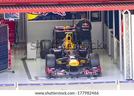 BARCELONA - FEBRUARY 24: Car of Red Bull F1 team in the pit during Formula One Teams Test Days at Catalunya circuit on February 24, 2012 in Barcelona, Spain.