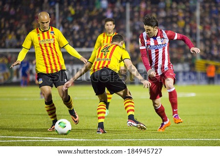 BARCELONA, SPAIN - DECEMBER 7: David Villa (R) of Atletico in action at Spanish Cup match between Sant Andreu and Atletico de Madrid, final score 0-4, on December 7, 2013, in Barcelona, Spain.