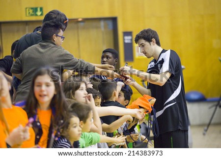 BADALONA, SPAIN - APRIL 13: Guillem Vives of Joventut signing autographs at Spanish Basketball League match between Joventut and Zaragoza, final score 82-57, on April 13, 2014, in Badalona, Spain.