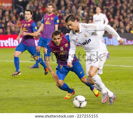 BARCELONA JANUARY 25 Cristiano Ronaldo R in action at the Spanish Cup match between FC Barcelona and Real Madrid final score 2 2 on January 25 2012 in Camp Nou Barcelona Spain BARCELONA JANUARY 25 Cristiano Ronaldo R in action at the Spanish Cup match between FC Barcelona and Real Madrid final score 2 2 on January 25 2012 in Camp Nou Barcelona Spain