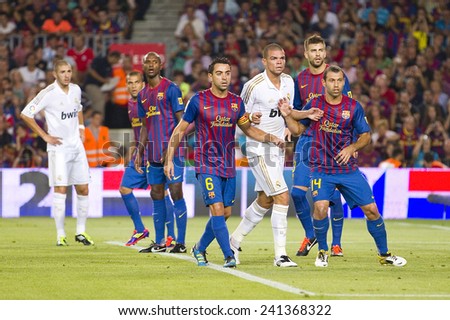 BARCELONA - AUGUST 17: Some players in action at the Spanish Super Cup final match between FC Barcelona and Real Madrid, 3 - 2, on August 17, 2011 in Camp Nou stadium, Barcelona, Spain.