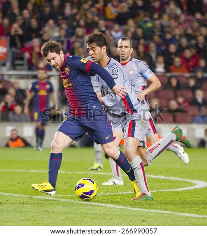 BARCELONA, SPAIN - JANUARY 27: Lionel Messi (L) of FCB in action at the Spanish League match between FC Barcelona and Osasuna, final score 5 - 1, on January 27, 2013, in Barcelona, Spain.