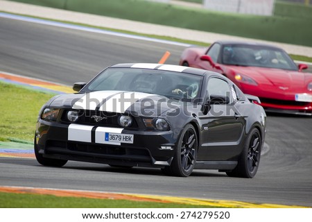 VALENCIA, SPAIN - APRIL 25: A black 2013 Ford Mustang take part in American Fest weekend organizated in circuit Ricardo Tormo, on April 25, 2015, in Cheste, Valencia, Spain.