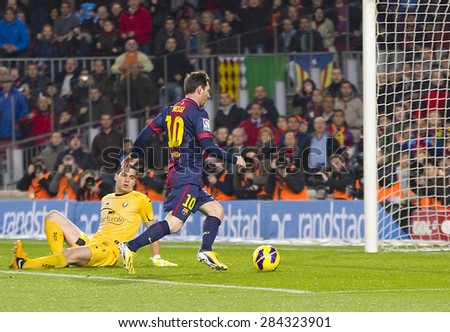 BARCELONA - JANUARY 4: Lionel Messi (10) scores a goal at the Spanish League match between FC Barcelona and Osasuna, final score 5 - 1, on January 27, 2013, in Barcelona, Spain.