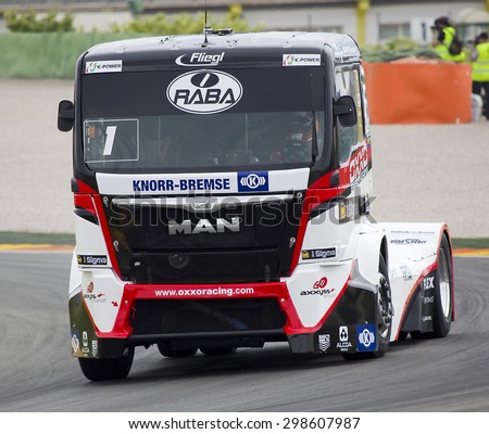 VALENCIA, SPAIN - APRIL 25: European Truck Racing Championship. Norbert Kiss of MAN team compete at Ricardo Tormo circuit, on April 25, 2015, in Cheste, Valencia, Spain. Jochen Hahn wins the race.
