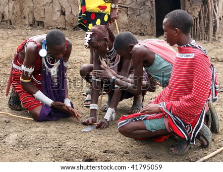 MASAI MARA - JUNE 23: Picture of some masai making a fire without matches. June 23, 2007 in Kenya.