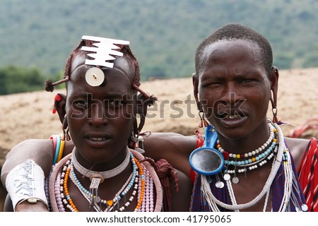 MASAI MARA - JUNE 23: Picture of two masai showing that the friendship exists around the world. June 23, 2007 in Kenya.