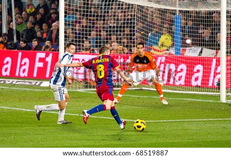 BARCELONA - DECEMBER 13: Nou Camp stadium, Spanish Soccer League match: FC Barcelona - Real Sociedad, 5 - 0. In the picture, Andres Iniesta shooting a goal. December 13, 2010 in Barcelona (Spain).