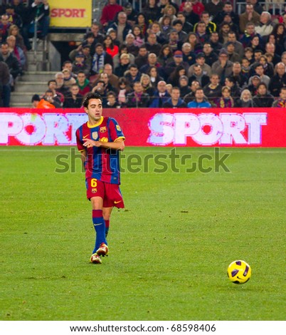 BARCELONA - DECEMBER 13: Nou Camp stadium, Spanish Soccer League match: FC Barcelona - Real Sociedad, 5 - 0. In the picture, Xavi Hernandez in action. December 13, 2010 in Barcelona (Spain).