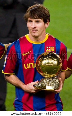 BARCELONA - JANUARY 12: Leo Messi offering the Gold FIFA World Player Trophy to the soccer supporters of Football Club Barcelona. January 12, 2011 in Nou Camp stadium, Barcelona (Spain).