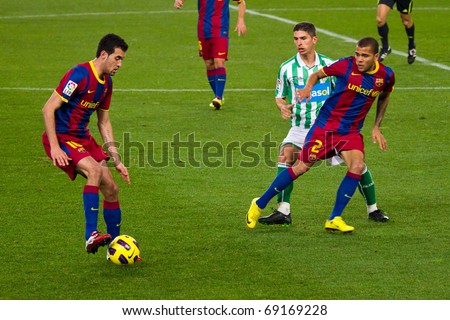 BARCELONA - JANUARY 12: Nou Camp football stadium, soccer Spanish Cup match: FC Barcelona - Real Betis, 5 - 0. In the picture, Sergio Busquets (left) in action. January 12, 2011 in Barcelona (Spain).
