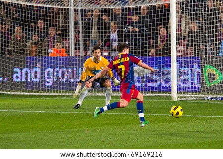BARCELONA - JANUARY 12: Nou Camp football stadium, soccer Spanish Cup: FC Barcelona - Real Betis, 5 - 0. In the picture, David Villa shooting a goal. January 12, 2011 in Barcelona (Spain).