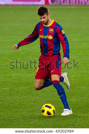 BARCELONA - JANUARY 12: Camp Nou football stadium, soccer Spanish Cup match: FC Barcelona - Real Betis, 5 - 0. In the picture, Gerard Pique in action. January 12, 2011 in Barcelona (Spain).