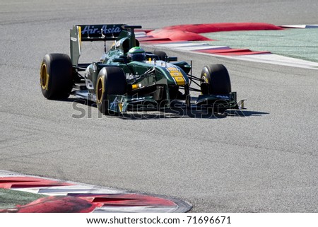BARCELONA - FEBRUARY 18: Kovalainen (Lotus) tests his new F1 car during Formula One Teams Test Days at Catalunya circuit February 18, 2011 in Barcelona (Spain).