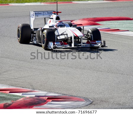 BARCELONA - FEBRUARY 18: Kobayashi (Sauber) tests his new F1 car during Formula One Teams Test Days at Catalunya circuit February 18, 2011 in Barcelona (Spain).
